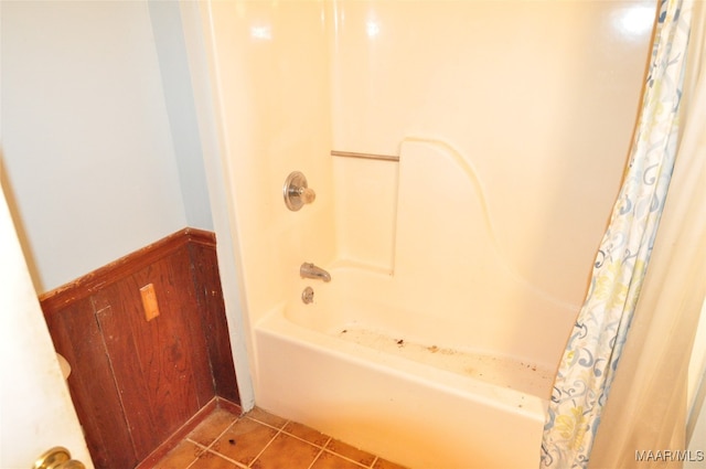 bathroom featuring shower / tub combo with curtain and tile patterned flooring