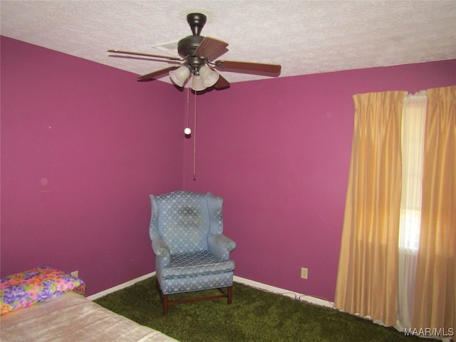 bedroom featuring carpet flooring, a textured ceiling, and ceiling fan