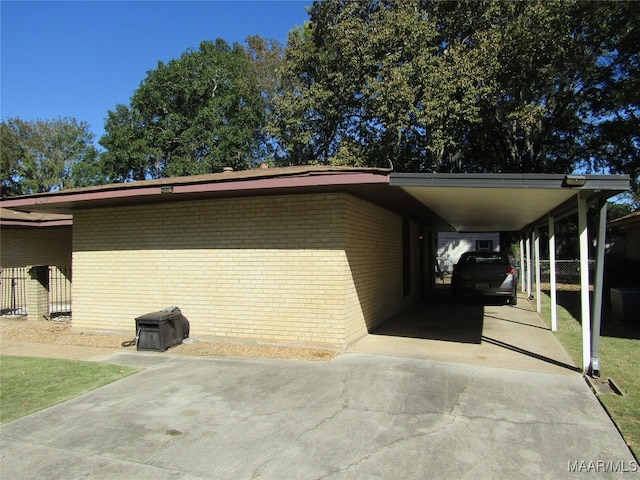 view of side of property featuring a carport