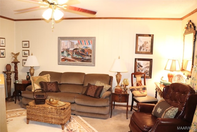 living room featuring light colored carpet, ceiling fan, and ornamental molding