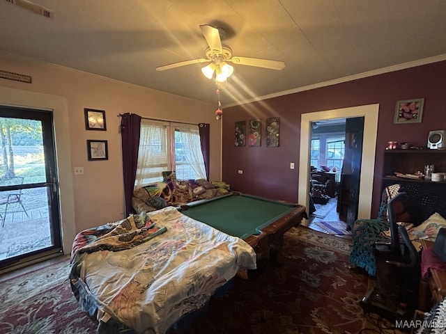 bedroom featuring multiple windows, ceiling fan, ornamental molding, and pool table