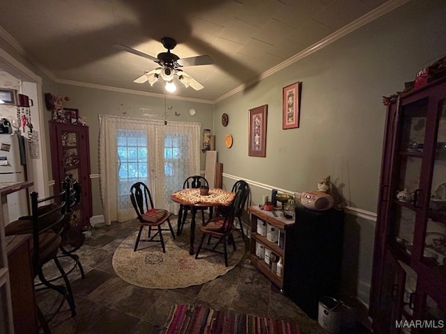 dining room with ceiling fan and ornamental molding