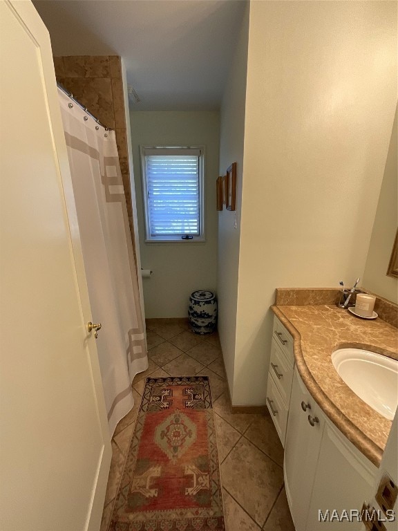 bathroom featuring vanity and tile patterned flooring