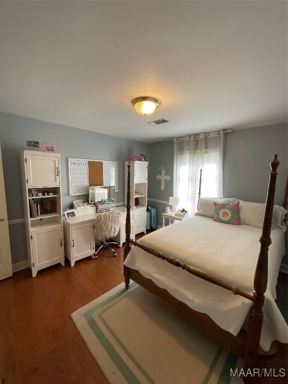 bedroom featuring hardwood / wood-style flooring