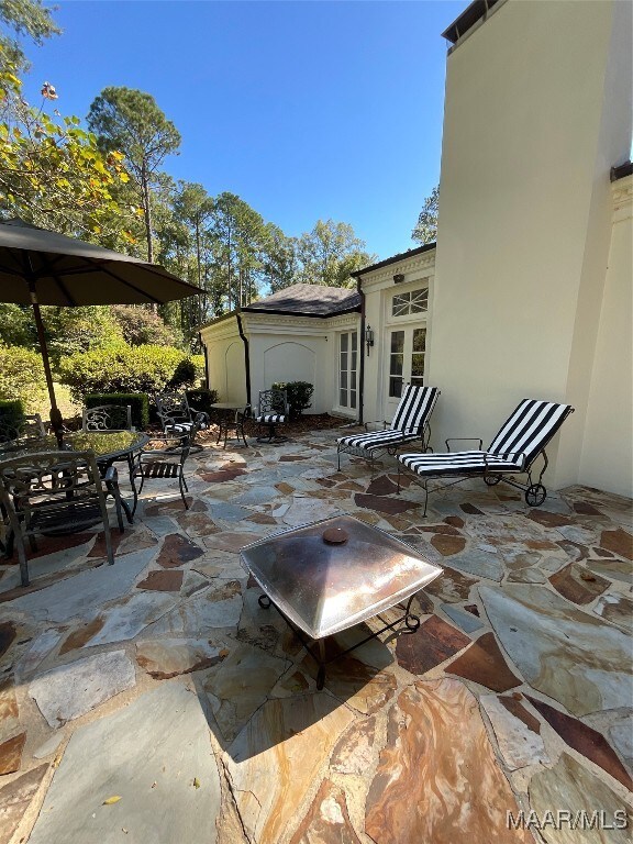 view of patio / terrace featuring a shed