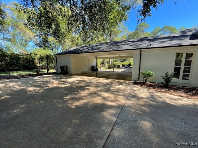 view of parking with a carport