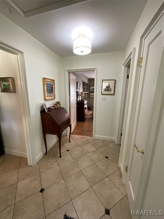 hallway with light tile patterned floors