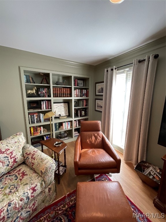 living area featuring hardwood / wood-style floors