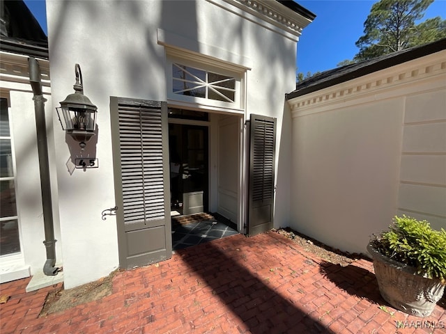 property entrance with a patio area