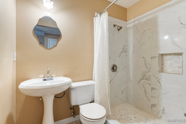 bathroom featuring toilet and a shower with curtain