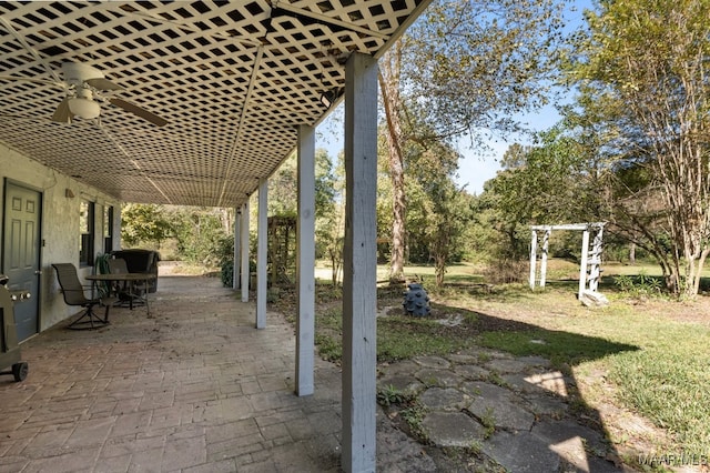 view of patio featuring ceiling fan