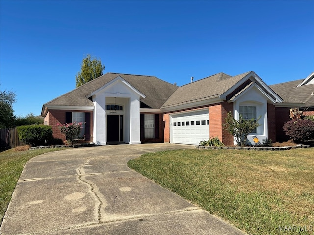 view of front of home with a garage and a front lawn