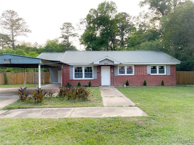 ranch-style home with a carport and a front lawn