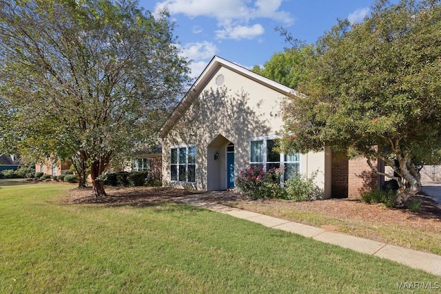 2106 Halcyon Blvd, Montgomery, AL 36117 - obstructed view of property with a front yard and stucco siding