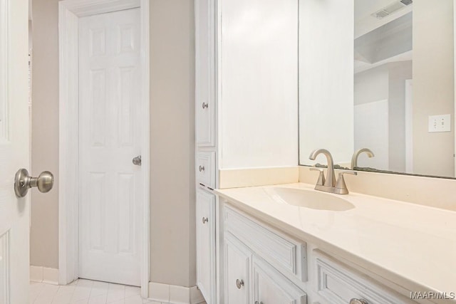 bathroom with vanity and tile patterned flooring