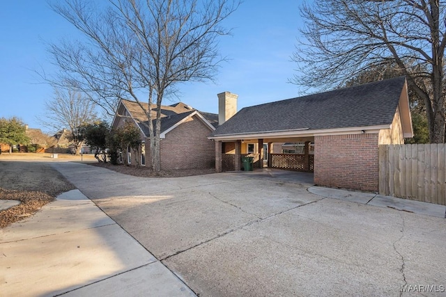 exterior space with a carport