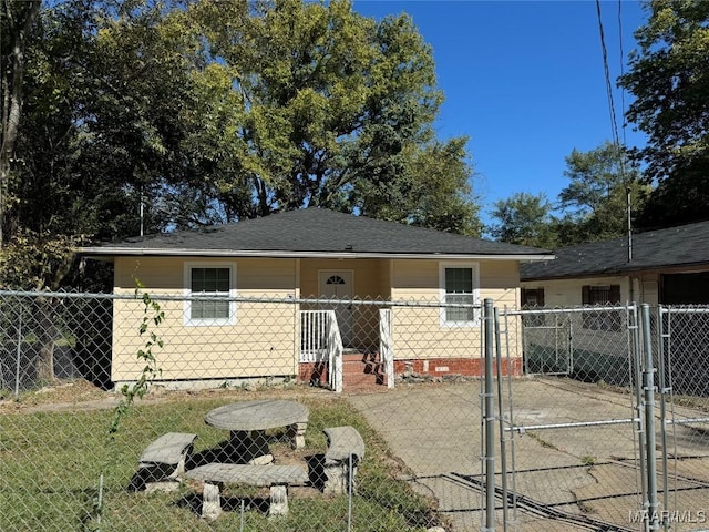 view of front of property with a gate and fence