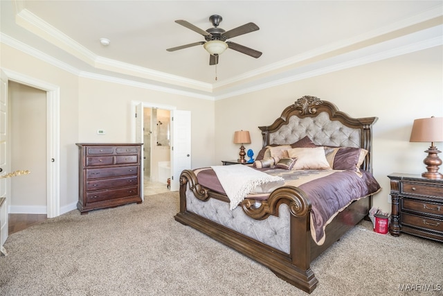 bedroom with ornamental molding, ceiling fan, light carpet, and ensuite bath