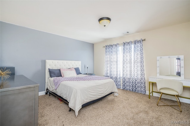 bedroom featuring carpet