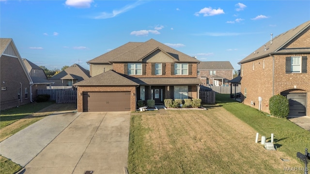 view of front of home featuring a garage and a front lawn