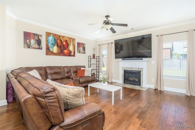 living room featuring crown molding, hardwood / wood-style flooring, and a wealth of natural light