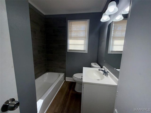 bathroom featuring vanity, toilet, and hardwood / wood-style floors