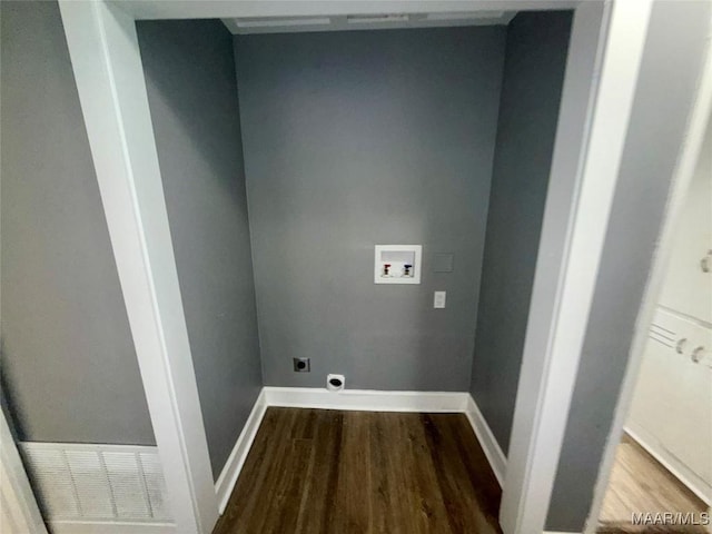 clothes washing area featuring hardwood / wood-style flooring, hookup for a washing machine, and electric dryer hookup