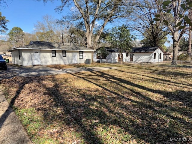 back of property with central AC, a lawn, and a patio