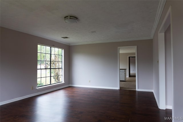 unfurnished room with a textured ceiling, dark hardwood / wood-style flooring, and ornamental molding