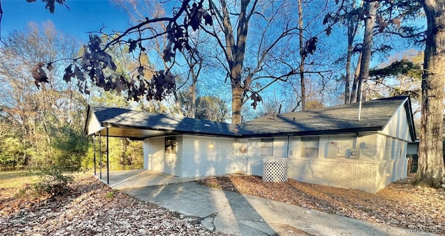 view of home's exterior featuring a carport