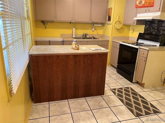 kitchen with white range with electric cooktop, sink, light tile patterned flooring, and a kitchen island