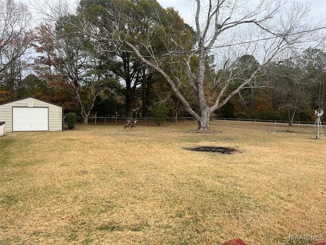 view of yard with an outdoor structure and a garage