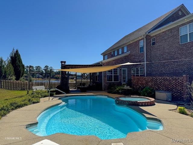 view of pool featuring an in ground hot tub