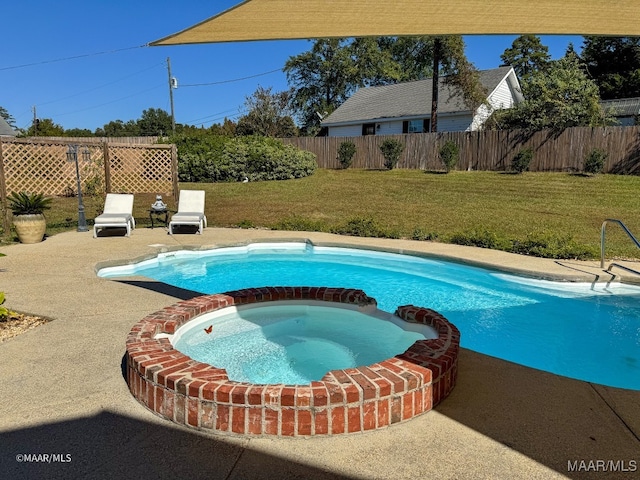 view of pool with a lawn and an in ground hot tub