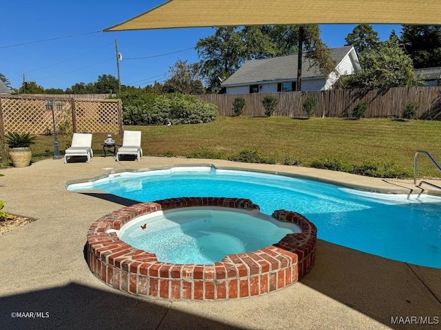 view of pool featuring fence, a patio area, a pool with connected hot tub, and a lawn