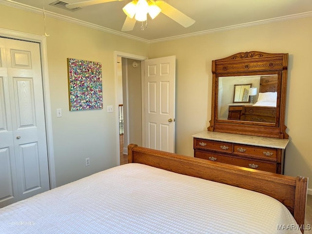 bedroom featuring crown molding, a ceiling fan, and visible vents