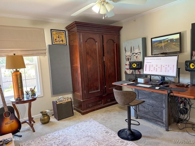 carpeted office space featuring ceiling fan and ornamental molding