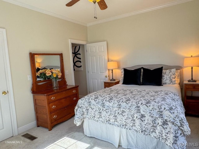 bedroom with light colored carpet, baseboards, visible vents, a ceiling fan, and crown molding