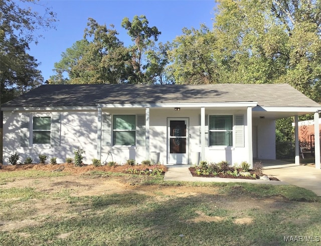 view of front of house featuring covered porch and a carport