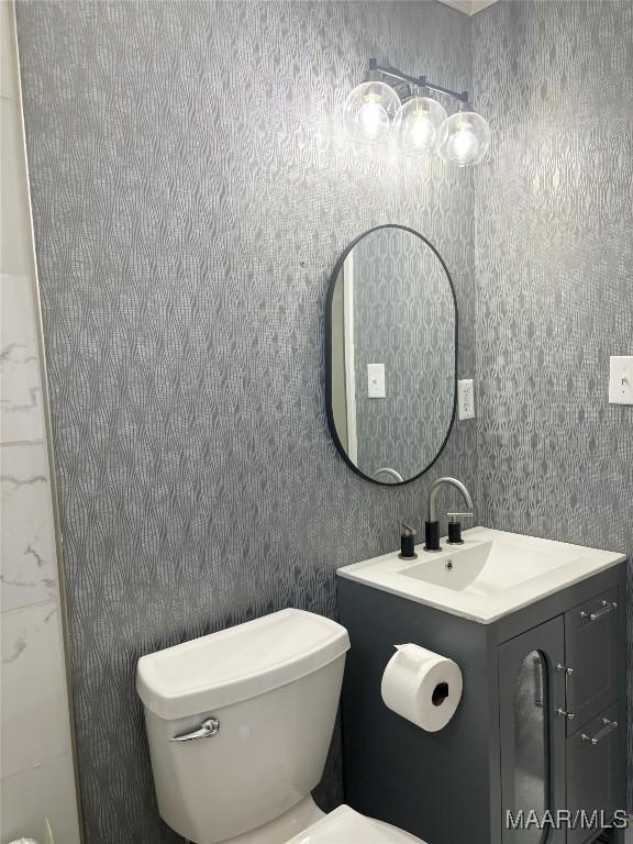 bathroom with vanity and toilet