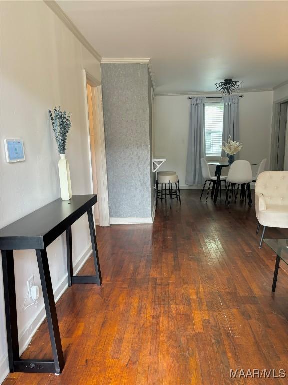 interior space with crown molding and dark hardwood / wood-style floors