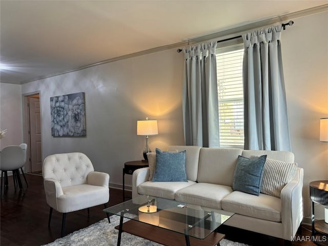 living room featuring hardwood / wood-style flooring and ornamental molding