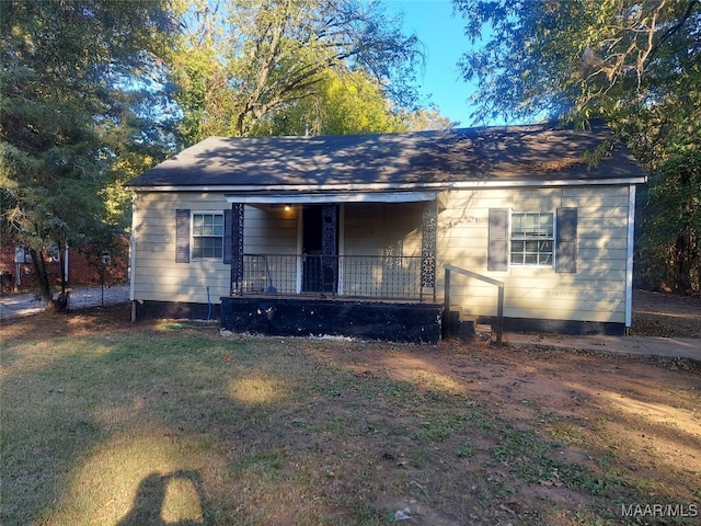 view of front of home with a front yard and a porch