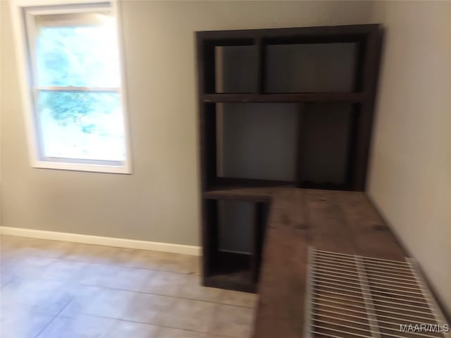 unfurnished bedroom featuring light tile patterned floors