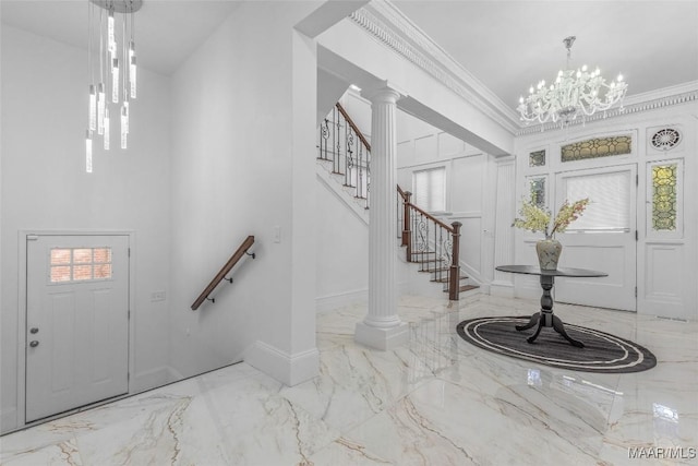 entryway featuring baseboards, marble finish floor, stairway, and crown molding