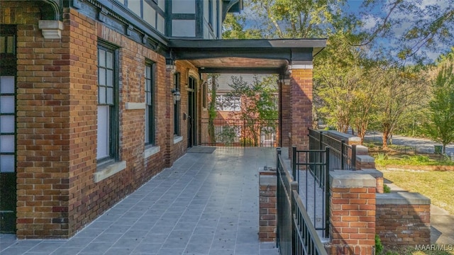 view of property exterior with brick siding