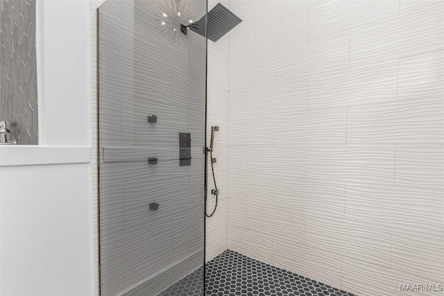 bathroom with a tile shower