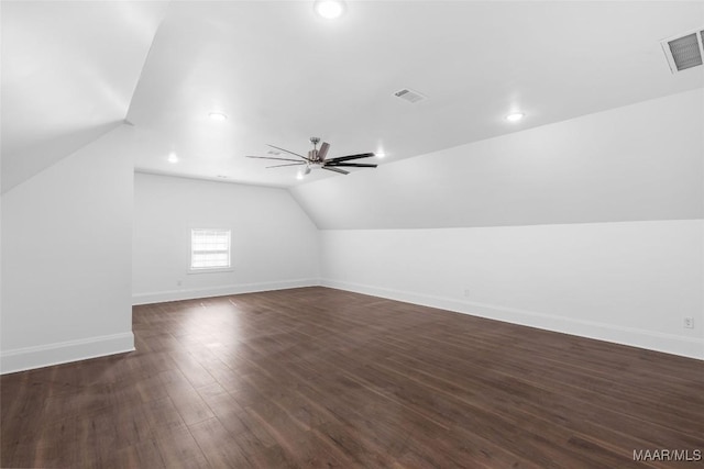 additional living space featuring ceiling fan, vaulted ceiling, visible vents, and baseboards
