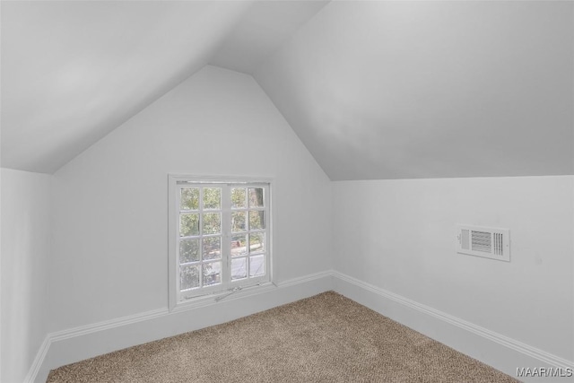 bonus room featuring baseboards, lofted ceiling, visible vents, and carpet