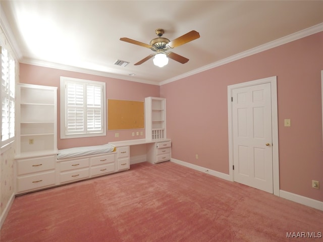 unfurnished bedroom featuring ornamental molding, light colored carpet, and ceiling fan